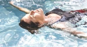 Woman enjoying the water in a swimming pool for sedation dentistry in Wolverhampton